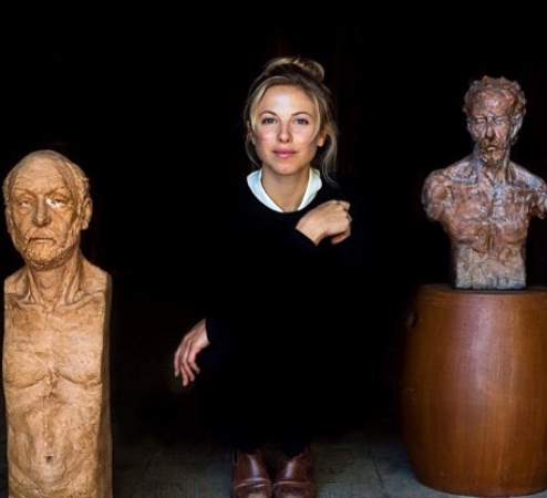 Gianna Distenca with her sculptures
